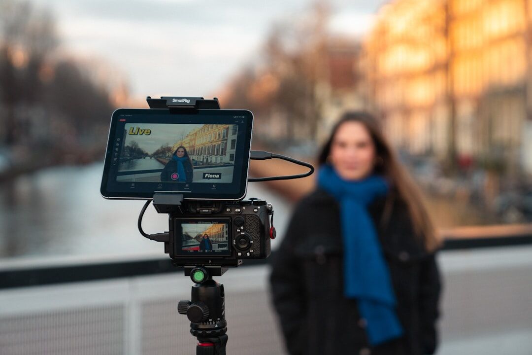 Video production director behind camera monitors in a live studio