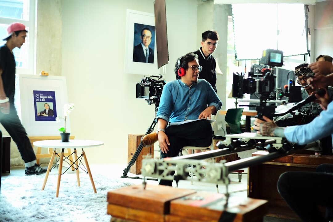 Students in a hands-on studio production workshop learning camera operation